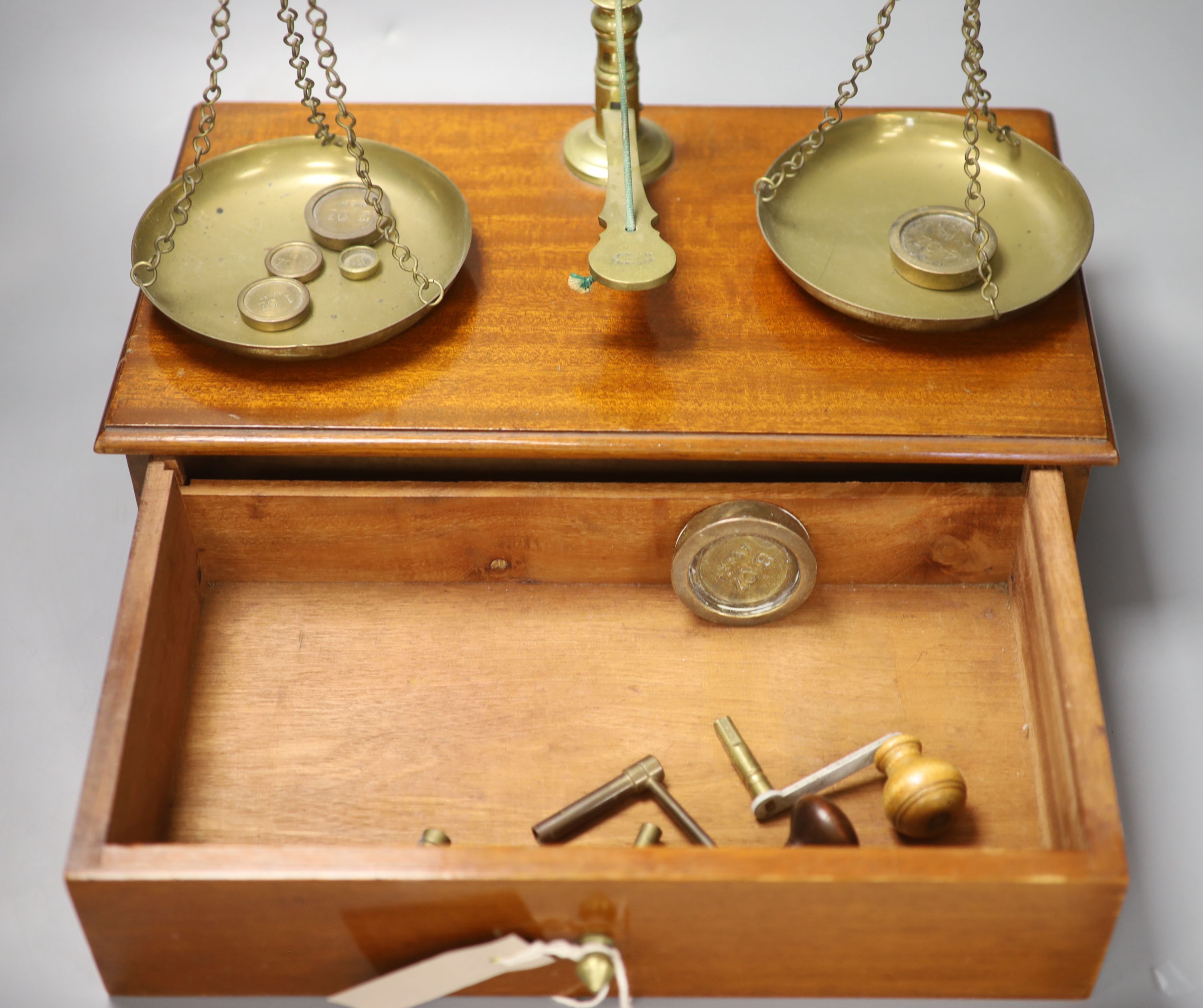 A set of late Victorian Avery scales, cased, 57cm high